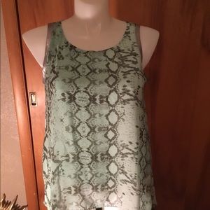 Jennifer Lopez sleeveless animal print blouse